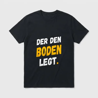 Bodenleger Lustig Spruch Beruf T-Shirt – Aufdruck „Der den Boden legt.“ in Weiß und Orange – Klassisches T-Shirt in Schwarz