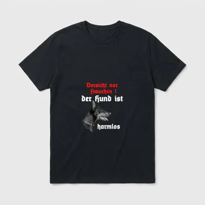 Hunde Sprüche T-Shirt – Dobermann mit Spruch „Vorsicht vor Frauchen, der Hund ist harmlos“ – Klassisches T-Shirt in Schwarz